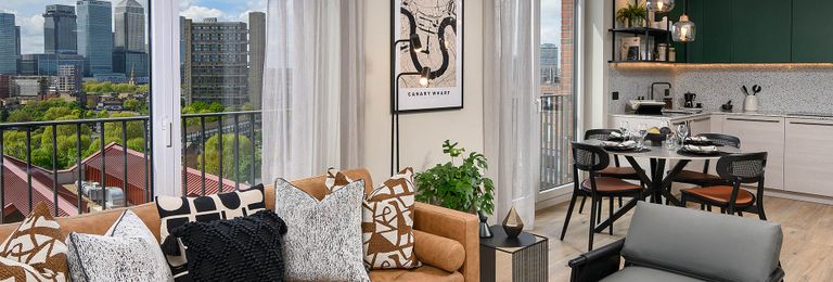 Property 1 of 5. Modern Decorated Living Space Overlooking Balcony With View Of City.