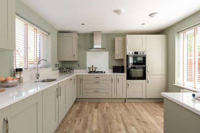 Property 3 of 14. The Modern Kitchen Has Ample Storage Space And A Stylish Breakfast Bar