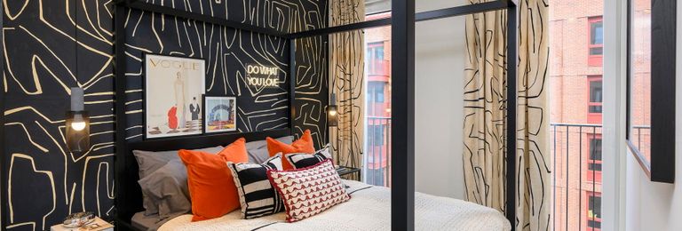 Property 3 of 5. 4 Post Bed With Modern, Abstract Design Décor, Floor To Ceiling Curtains.