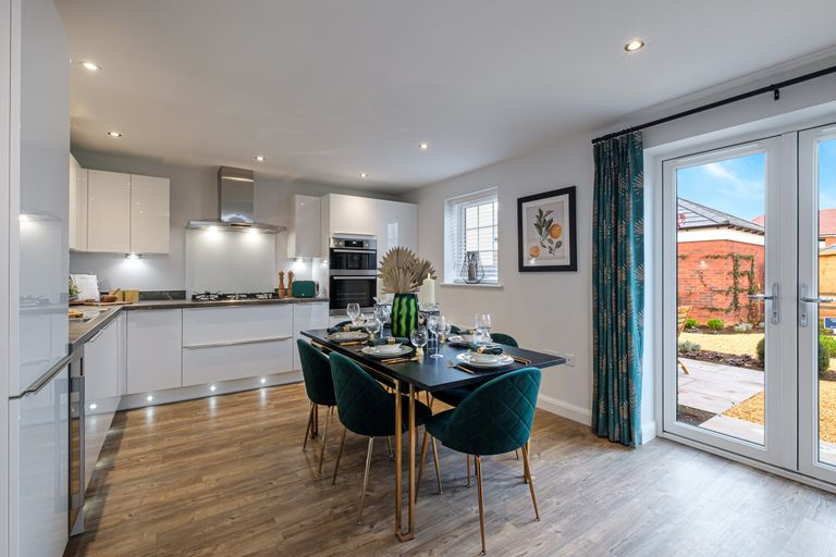 Property 1 of 9. Large Kitchen With Blue Chairs And French Doors To Garden